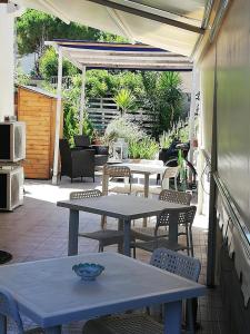 an outdoor patio with two tables and chairs at B & B Eliana e Ristorante in Florence