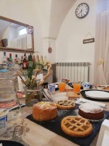 a table with cakes and cookies on a table at B & B Eliana e Ristorante in Florence