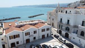 an aerial view of buildings and the water at Hotel Punta San Francesco in Vieste