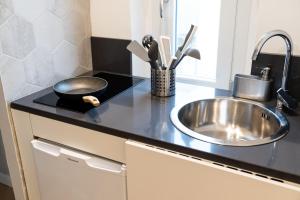 Kuchyň nebo kuchyňský kout v ubytování Residence Sferisterio