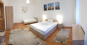 a bedroom with a bed in a room at Fabini Apartments in Mediaş