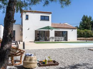 a villa with a view of the house at Holiday Home Beaufort with Private Pool in Beaufort