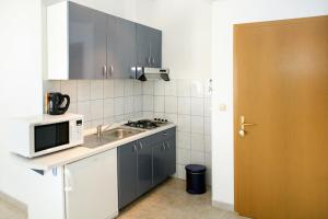 Kuchyň nebo kuchyňský kout v ubytování Apartments Davor & Marija Sosic