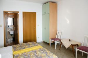 Postel nebo postele na pokoji v ubytování Apartments Davor & Marija Sosic