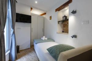 Postel nebo postele na pokoji v ubytování Stara Kala Varos Apartment