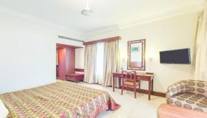 RNS Residency Sea View客房内的一张或多张床位