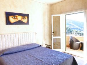 Postel nebo postele na pokoji v ubytování Villetta Paradiso by ArgonautiVacanze