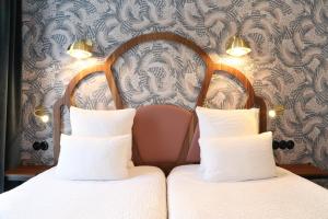 Letto o letti in una camera di Hotel André Latin