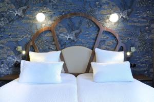 Letto o letti in una camera di Hotel André Latin