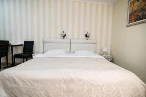 Postel nebo postele na pokoji v ubytování Garni Hotel Dash