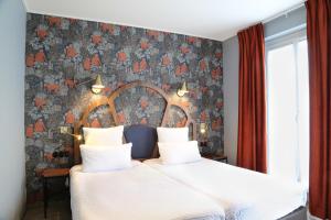 Letto o letti in una camera di Hotel André Latin