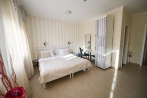 Postel nebo postele na pokoji v ubytování Garni Hotel Dash
