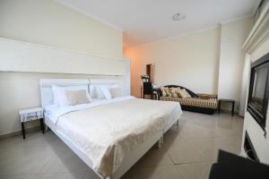 Postel nebo postele na pokoji v ubytování Garni Hotel Dash