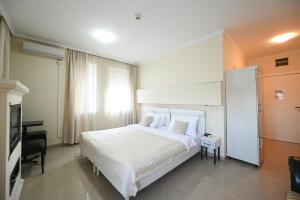 Postel nebo postele na pokoji v ubytování Garni Hotel Dash