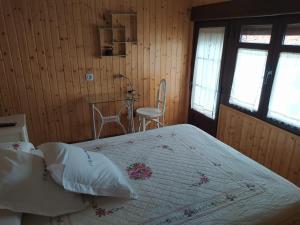 Łóżko lub łóżka w pokoju w obiekcie Casa Rural Abuela Maxi