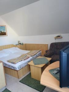 Postel nebo postele na pokoji v ubytování Gála Panzió
