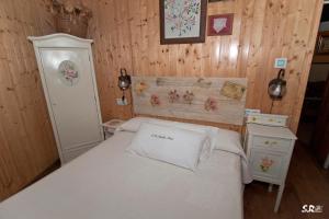 Łóżko lub łóżka w pokoju w obiekcie Casa Rural Abuela Maxi