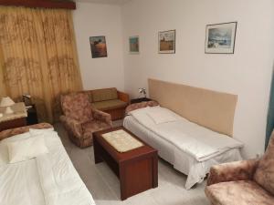 Postel nebo postele na pokoji v ubytování Gála Panzió