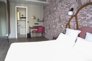 Letto o letti in una camera di Hotel André Latin
