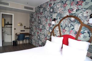 Letto o letti in una camera di Hotel André Latin