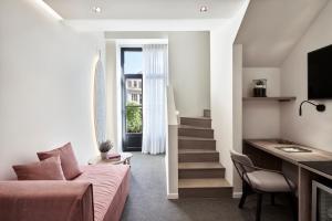 Televízia a/alebo spoločenská miestnosť v ubytovaní NLH MONASTIRAKI - Neighborhood Lifestyle Hotels