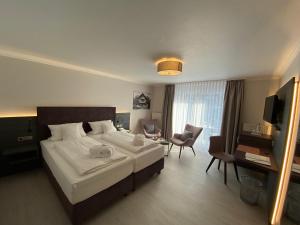 Postel nebo postele na pokoji v ubytování Hotel Ritter Badenweiler