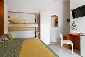Postel nebo postele na pokoji v ubytování Hotel Principe