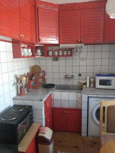 A kitchen or kitchenette at Апартамент Алекс