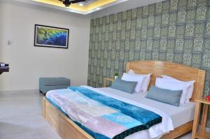 a bedroom with a large bed in a room at Edha Homestay in Port Blair