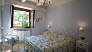 A bed or beds in a room at Agriturismo Pascucci