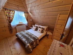 Posteľ alebo postele v izbe v ubytovaní Alpinka