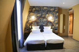 Letto o letti in una camera di Hotel André Latin