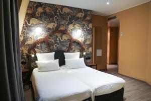 Letto o letti in una camera di Hotel André Latin