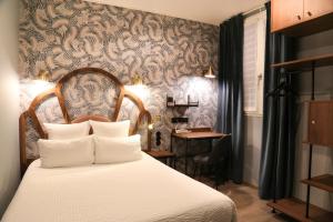 Letto o letti in una camera di Hotel André Latin