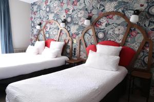 Letto o letti in una camera di Hotel André Latin