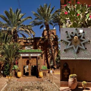 a resort with palm trees and a building with a star at Riad Dar Sofian in Zagora