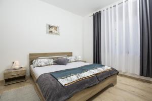 Postel nebo postele na pokoji v ubytování Apartment Josipa 4209