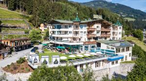 an aerial view of a hotel in the mountains at Alpin Family Resort Seetal in Kaltenbach