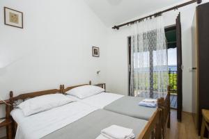 Ein Bett oder Betten in einem Zimmer der Unterkunft Apartment Vili