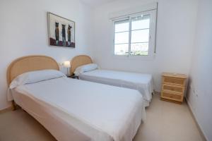 Postel nebo postele na pokoji v ubytování PENTHOUSE LAS GAVIOTAS II-2E Menyber + 21 fotografií