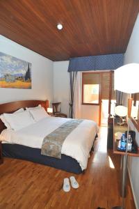 Postel nebo postele na pokoji v ubytování Hotel Hermitage