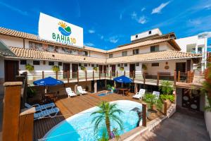 a view of the front of a hotel with a swimming pool at Pousada Bahia 10 in Morro de São Paulo