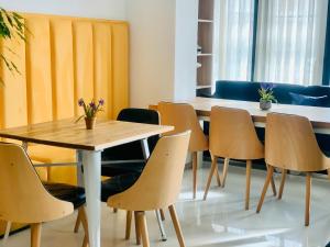 a dining room with a table and chairs at Park Hotel Tirana in Tirana +93 photos