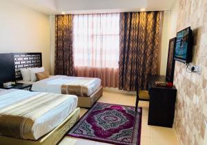 Cama o camas de una habitación en Mira Suites Prince Sultan Street-Jeddah