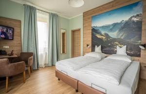 Postel nebo postele na pokoji v ubytování Alpenstadthotels