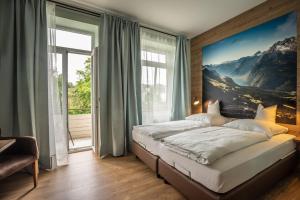Postel nebo postele na pokoji v ubytování Alpenstadthotels