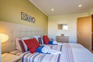 Giường trong phòng chung tại Vilamoura Boutique Apartment