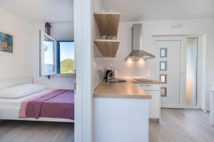 Postel nebo postele na pokoji v ubytování Camping Homes Grot