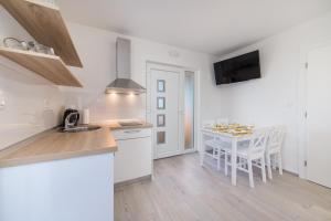 Kuchyň nebo kuchyňský kout v ubytování Camping Homes Grot