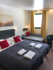 Posteľ alebo postele v izbe v ubytovaní Avila Park & SPA